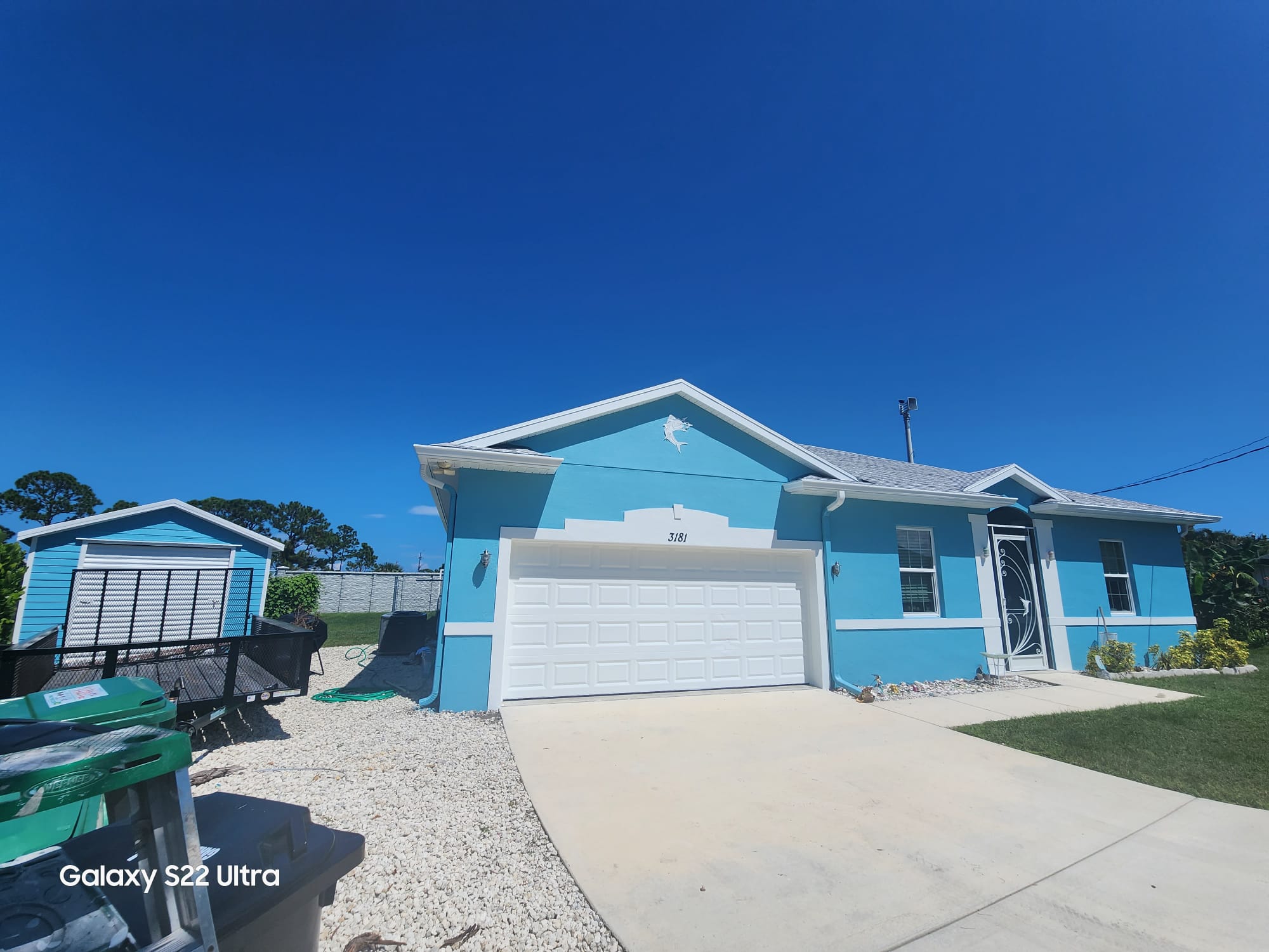 Finished light blue single-story home exterior
