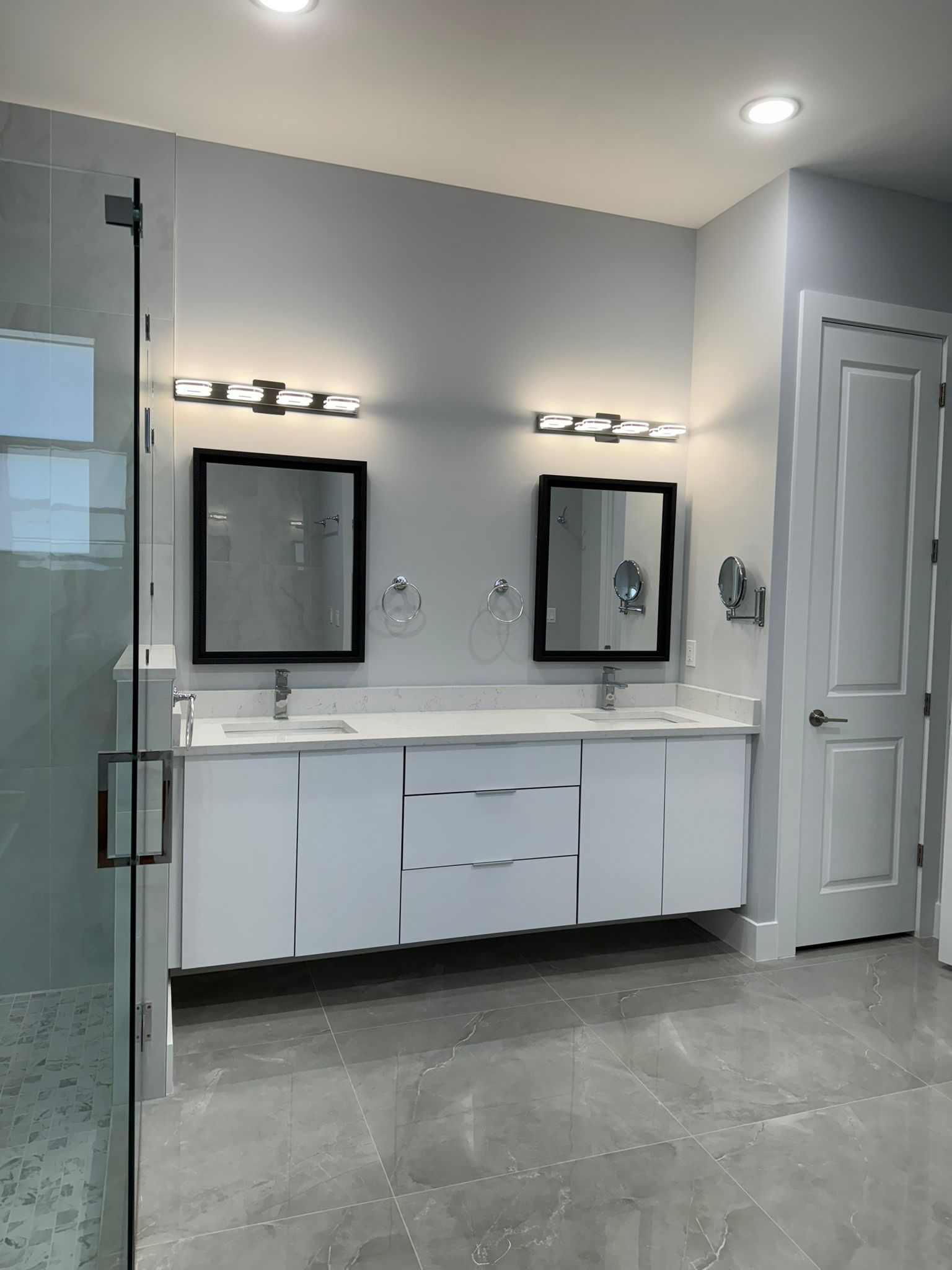 Bathroom with dual vanity and refinished cabinetry
