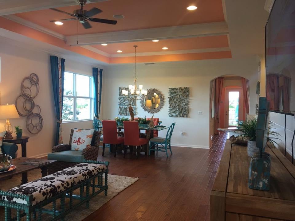 Freshly painted coastal living and dining room with striped tray ceiling