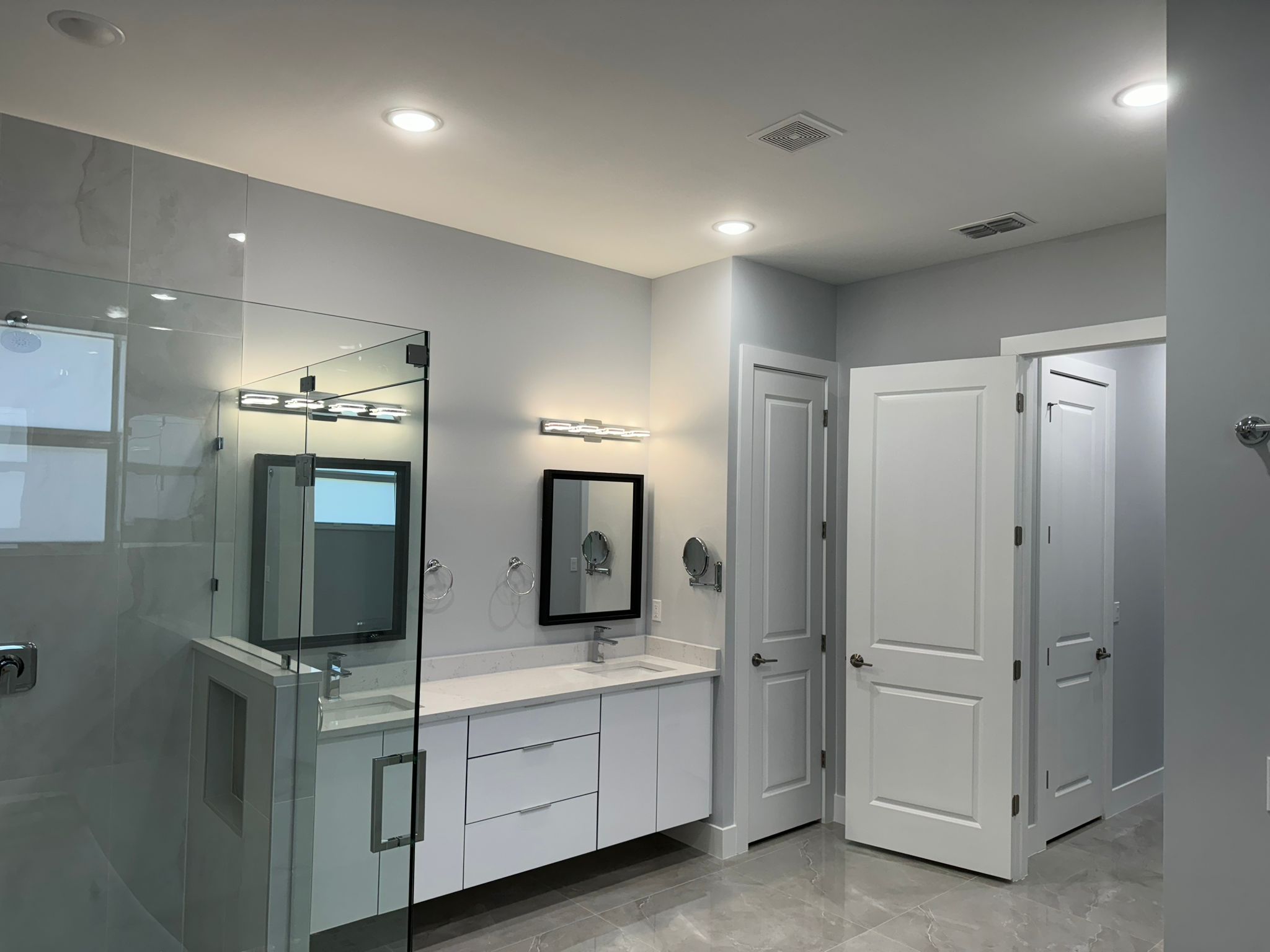 Master bathroom with double vanity and freshly painted walls