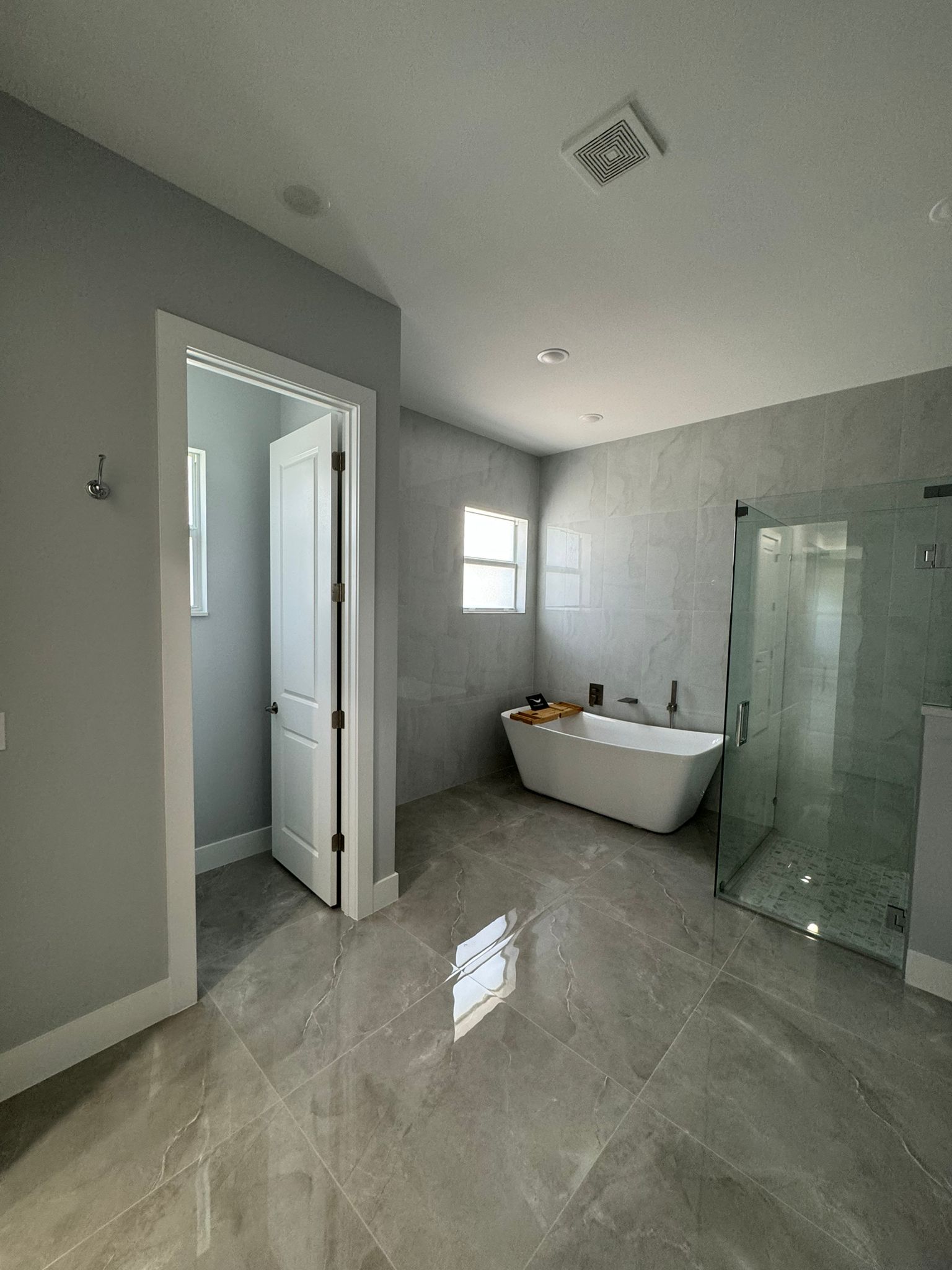 Master bathroom with freestanding tub and glass shower