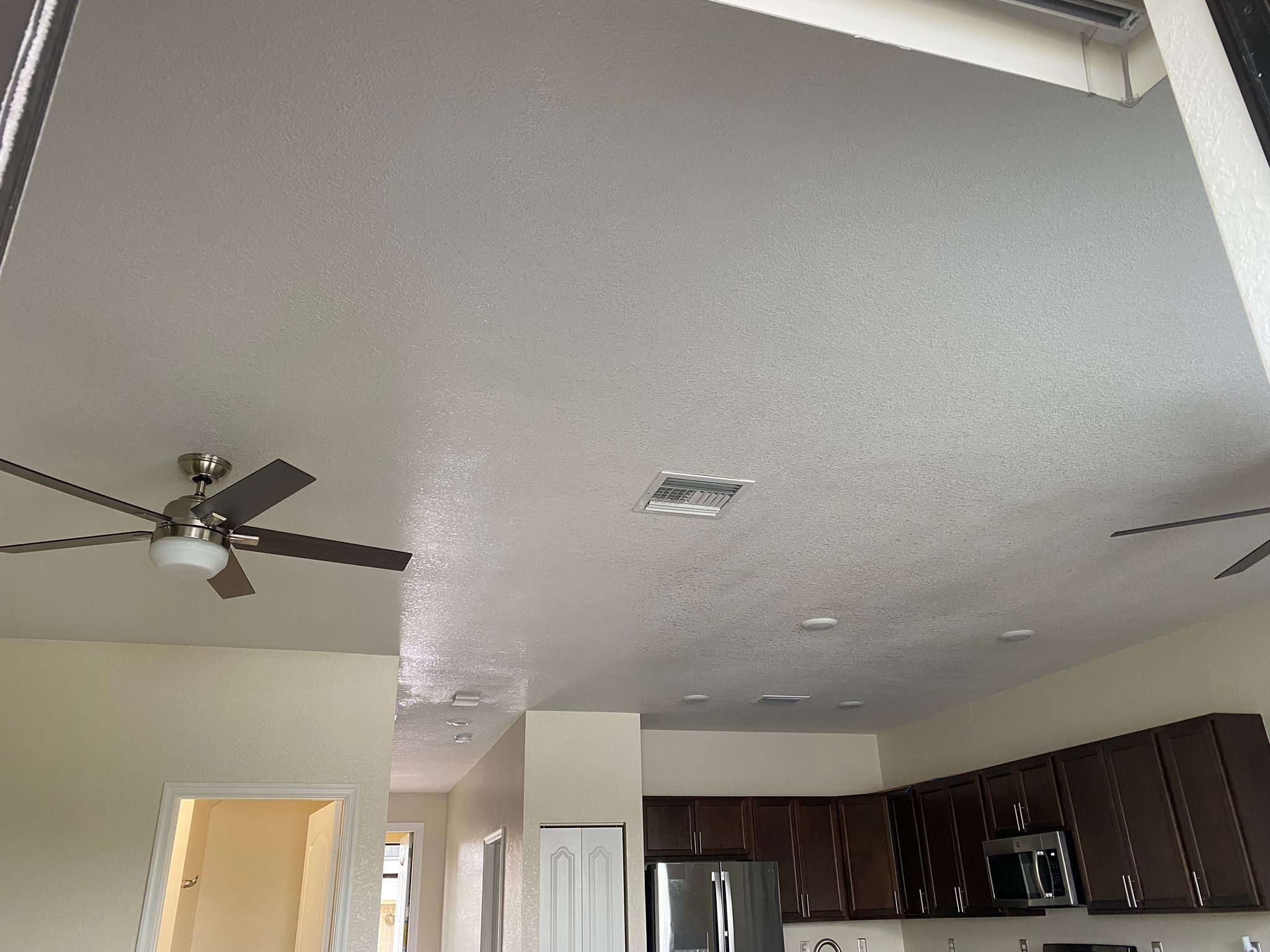 Kitchen with freshly repaired and painted ceiling