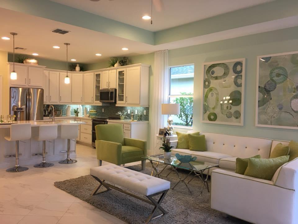Seafoam green open concept kitchen and living room