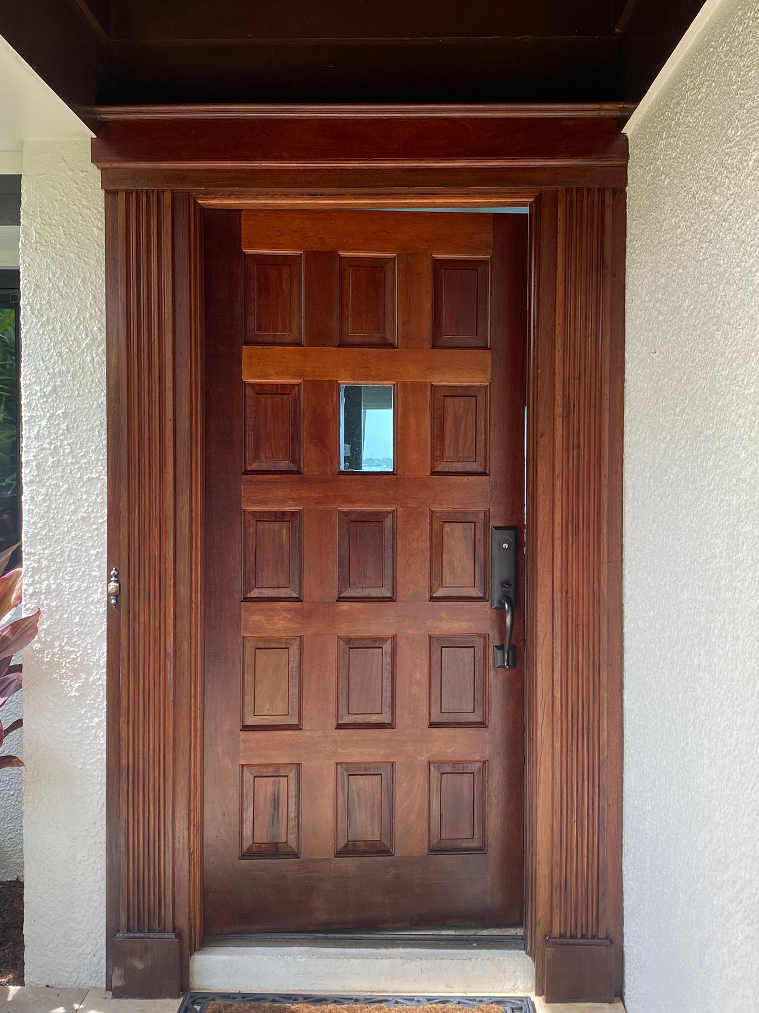 Refinished mahogany front door with rich stained wood finish